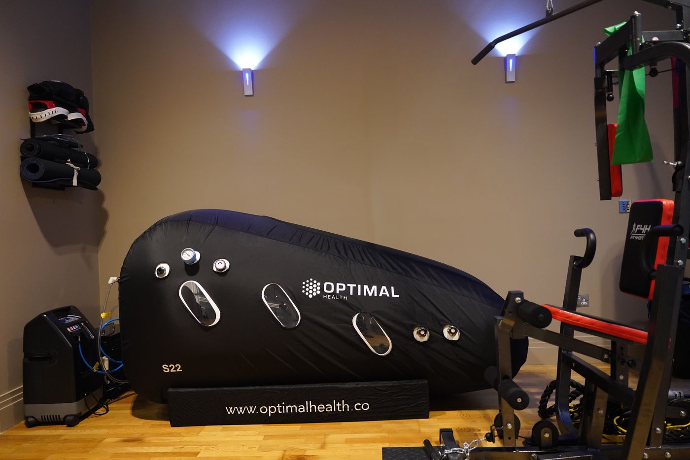 HBOT Softshell Lay Down set up in a home gym