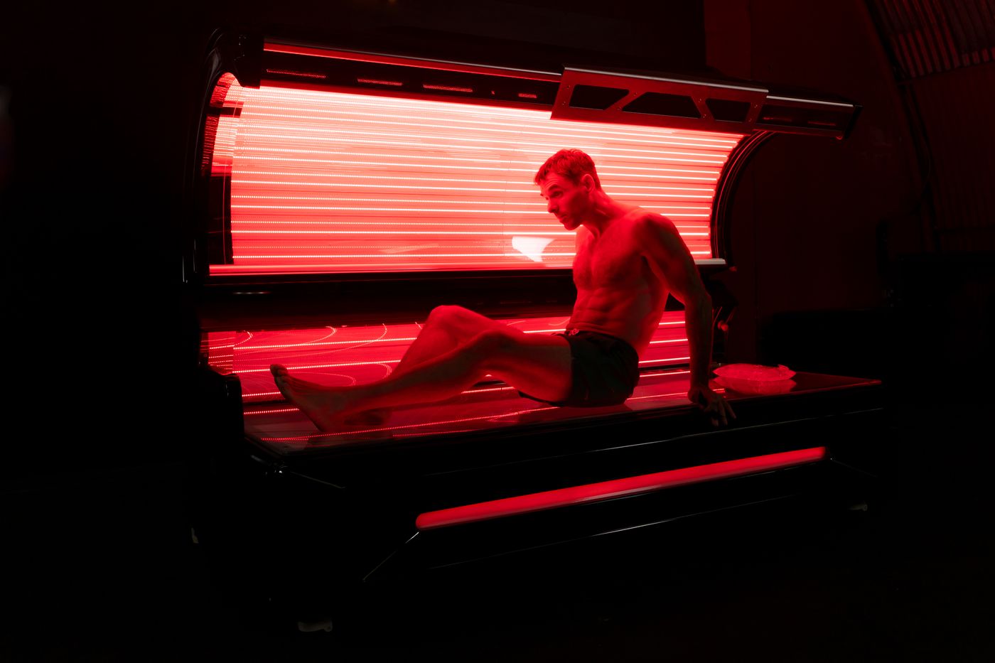 Relaxing under the Red Light Therapy Bed